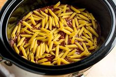 pasta is being cooked in the slow cooker