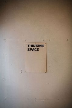 a sign on the wall that says thinking space