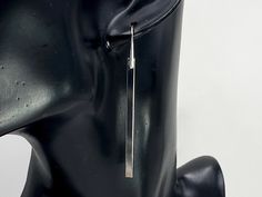 "Simple, stylish, yet sophisticated, this pair of earrings feature sleek silver long bars, suspended from minimalist modern hooks. The earring hooks are made of 925 sterling silver, with or without gold plating. The bars are made of brass with silver plating. The earrings is about 2 5/8 inches long. Mannequin head is smaller than average head size - please refer to these actual measurements. The same design is available in sculptural brass earring hooks: https://www.etsy.com/listing/673847038/mi Black Earrings Dangle, Mannequin Head, Geometric Star, Hammered Gold, Geometric Triangle, Jewelry Show, Triangle Earrings, Gunmetal Grey, Silver Bars