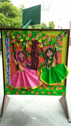 a sign with two women on it that says happy holi day and is decorated with paper flowers