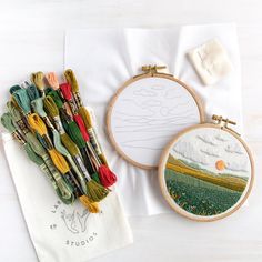 a table topped with different types of embroidery