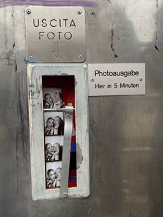 an old metal box with photos in it