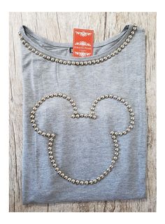 a mickey mouse shirt with pearls on it