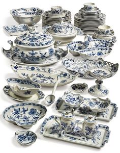 a collection of blue and white china