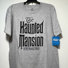 a t - shirt hanging on a hanger that says, the haunted mason is my happy place