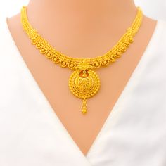 This 22k gold necklace set features a traditional laced paisley design, showcasing timeless elegance and intricate craftsmanship. Weighing 32.2 grams, the set is crafted from radiant yellow gold, with a 16-inch necklace that includes 1.75-inch adjustable links and a secure hook lock. The matching earrings, 1.6 inches in length, are equipped with screw-back posts for secure wear. The classic paisley motifs, combined with the delicate laced design, make this set perfect for those who appreciate th 22k Yellow Gold Necklaces For Diwali, Yellow Gold 22k Necklace For Diwali, 22k Yellow Gold Necklace For Diwali, Traditional Yellow Gold-plated Necklace, Yellow Temple Jewelry With Filigree, Yellow Filigree Jewelry For Festivals, Yellow Gold Kundan Necklace With Intricate Design, Traditional Yellow Necklace With Intricate Design, Gold Plated Yellow Jewelry With Intricate Design