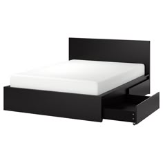 a bed with two drawers underneath it and a white sheet in the bottom drawer area