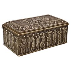 an ornate metal box with figures on it