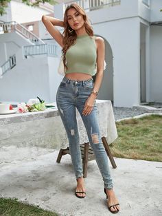 Our Zavier Top comes in a sage green tone. This ribbed, high neckline, sleeveless crop top is the perfect transitional piece! Pair with your favourite denim jeans for an effortless look going into the warm weather! Size Guide: Susan is 5’2” tall, and has a 33.2” bust, 24.5”waist, & 36.7” hips. She is wearing a S / US 4 / AU 8. This crop top is true to size. Feature: Relaxed fit. Lightweight. Unlined. High neck. Stretchable fabric. Material: 70% Viscose, 30% Polyester. Care Instructions: Machine Casual High Waist Crop Top For Fall, Trendy Green Tank Top For Fall, Green Tone, Selling Clothes, Sleeveless Crop Top, Daily Dress, Knit Crop Top, Knit Crop, Knit Jumper