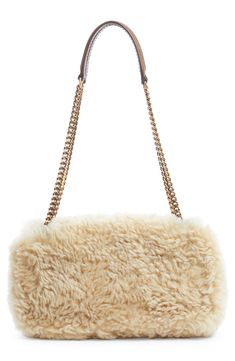 Plush shearling brings a luxurious tactile element to this compact shoulder bag finished with a pull-through strap and branded with a YSL insignia. Magnetic-snap flap closure Pull-through chain-and-leather strap Interior zip pocket Genuine shearling (Iceland) Made in Italy Designer Handbags Luxury Shoulder Bag With Faux Fur Lining, Luxury Sheepskin Bags With Faux Fur Lining, Luxury Leather Shoulder Bag With Faux Fur Lining, Bronze Hardware, The Saint, I See It, Quilted Leather, Chain Bags, Flap Bag