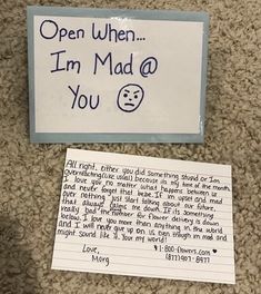 a note is posted on the floor next to a sign that says, open when i'm mad at you