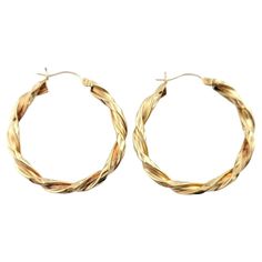 Vintage 14K Yellow Gold Twisted Hoop Earrings This gorgeous set of 14K gold hoop earrings are in a beautiful, twisted design! Diameter: 33.55mm Width: 4.0mm Weight: 4.5 g/ 2.9 dwt Hallmark: JAW 14K Very good condition, professionally polished. Will come packaged in a gift box or pouch (when possible) and will be shipped U.S. Priority Mail Insured. MM121823/17KCS Gold Twist Hoop Earrings, Twisted 14k Yellow Gold Hoop Earrings, Yellow Gold Hoop Earrings With A Modern Twist, Modern Twist Yellow Gold Hoop Earrings, 14k Gold Hoop Earrings With A Modern Twist, Modern Twist 14k Gold Hoop Earrings, Twisted 14k Gold Hoop Earrings, 14k Gold Hoop Earrings, Twisted Hoop Earrings