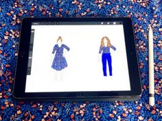 the tablet is displaying an image of a woman's dress and pants on it