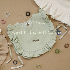 Keep their clothing protected underneath the sweet frills and soft colors of our new frilled bibs. Available in cream, hazel, and olive, these bibs are made for stylish little ones with messy habits! Our solid ruffle bib has a snap at the neck and ties on both sides. Size: 11.8'' width and 10'' length Color Option: Cream, Hazel (Brown), Olive (Green) Care: Hand Wash Cold and Air Dry Recommended Embroidery: MAX 10 letters. Crochet Bibs, Crochet Bib, Toddler Bib, Toddler Bibs, Girls Bib, Baby Sewing Projects, Junior Fashion, Halloween Crochet, Sweet Gifts