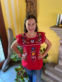 Beautiful Mexican blouse with floral style hand embroidery and lace details on the cuff. Each blouse is embroidered by hand and they are unique pieces so colors may vary. Mexican textile art has centuries of history and creativity throughout the country. Mexico is recognized as one of the leading countries with a beautiful artistic production in the textile world, miraculous hands of talented artisans from different states of the country create stunning embroidery clothing, and various items. #Oaxaca #Chiapas We ship anywhere in the word, from Tepic, Nayarit,  mx. Made by artisans from Oaxaca, Mx We recommend washing by hand with cold water, tender in the shade, to better preserve the original color. Traditional Blouse With Embroidered Sleeves, Festive Traditional Tops With Embroidered Sleeves, Bohemian Resham Embroidery Top For Festival, Bohemian Resham Embroidered Top For Festival, Bohemian Embroidered Top With Embroidered Border For Festivals, Bohemian Embroidered Top For Festivals, Bohemian Floral Embroidered Top For Festive Occasions, Cotton Folk Top With Embroidered Sleeves, Bohemian Embroidered Top With Floral Design For Festive Occasions