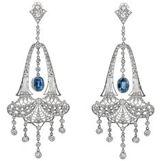 Chandelier drop earrings finely crafted in platinum. Total diamond weight is approximately 5.00 CT. The two center sapphire weighs an approximate 6.70 CT. Gorgeous elegant statement earrings! Evening Diamond Chandelier Earrings, Winter Court, Diamond Chandelier Earrings, Diamond Chandelier, Jewelry Design Drawing, Historical Jewellery, Vintage Charm Bracelet, Accessory Jewelry, Beautiful Chandelier