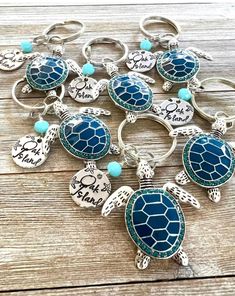 turtle keychains with sea turtles and words on them