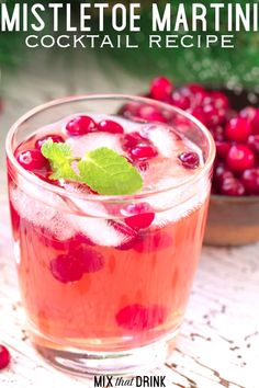 cranberry mistlet martini cocktail recipe in a glass with mint garnish