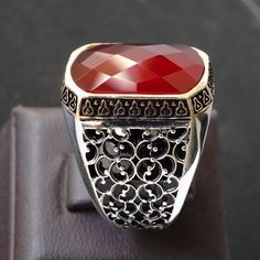 925 STERLING SILVER MENS RING WITH RED RUBY METAL : .925 Sterling Silver  STONE: Ruby (lab-created) DIMENSIONS OF THE STONE : 18 x 13 mm  SIZE: US 10 (FREE RESIZING) *your ring can be resized to any size between 8 and 13 US.    if you prefer a different size just attach a note during order. Artisan Red Jewelry For Anniversary, Luxury Handmade Silver Ruby Ring, Handmade Red Sterling Silver Signet Ring, Silver Ruby Ring With Stone Setting, Unique Silver Ruby Ring With Polished Finish, Luxury Silver Ruby Ring With Stone Setting, Artisan Red Sterling Silver Rings, Handmade Luxury Sterling Silver Ruby Ring, Engraved Sterling Silver Ruby Ring