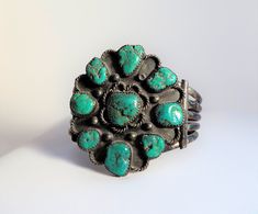 This is truly vintage turquoise. I am pretty sure it was made in the late 40's or very early 50's. It is stamped Sterling, including the initial stamp W. Vintage Patina Cuff Bracelet, Vintage Turquoise Stamped Cuff Bracelet, Vintage Turquoise Stamped Bracelets, Vintage Green Bracelet With Patina, Green Vintage Cuff Bracelet, Handmade Turquoise Vintage Cuff Bracelet, Vintage Blue Cuff Bracelet, Adjustable Vintage Turquoise Cuff Bracelet, Adjustable Turquoise Vintage Cuff Bracelet