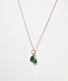 A pear shaped emerald pendant set in 14k yellow gold. Each emerald has colors and textures unique to each stone. Specifications: 2.5-3 ct emerald, set in 14k gold. Stone is approximately 8x11.5 mm. Chain sold separately. Browse other chains here. Add our Carabiner to complete your look. Emerald Pendant Set, Emerald Set, Bezel Necklace, Tourmaline Pendant, Emerald Pendant, Bezel Pendant, Gold Stone, Emerald Earrings, Yellow Gold Chain