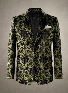 Sartorial luxury takes a classy turn in our Epitome Velvet Blazer. Painstakingly crafted from a cotton blend material, it provides comfort without sacrificing style. The lustrous black ethnic motifs on a velvety, revitalizing green backdrop create an electrifying visual symphony, adding a touch of regality to your attire. Perfect for weddings, grand occasions, high-class celebrations, or parties, this magnificent masterpiece will elevate your look and make you the center of attention. 
  An elus Luxury Fitted Black Blazer, Elegant Black Cotton Blazer, Luxury Black Spring Blazer, Fitted Black Cotton Blazer, Silver Leather Jacket, Brown Tweed Suit, Tweed Overcoat, Dapper Suits, Velvet Tuxedo