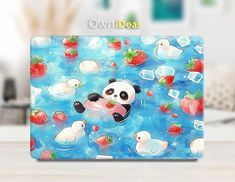 a panda bear is floating in the water with strawberries