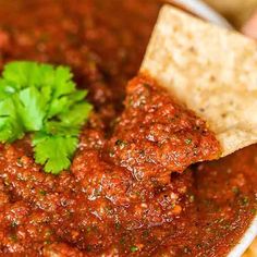 a bowl filled with salsa and tortilla chips