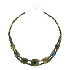 Jay King Nephrite Jade and Labradorite Reversible Necklace Gorgeous green nephrite jade and lovely labradorite together create a fun styling option with two unique looks in one versatile design. Simply reverse the necklace to change up your look! From Jay King.       Approx. 18"L x 15/16"W with 2-3/4" extender     Stamped .925     Hook closure     Dark green nephrite jade necklace has nine double-sided, barrel-shaped, faceted stations along drape     Each station has multicolor labradorite on on Spiritual Green Labradorite Necklaces, Spiritual Green Labradorite Necklace, Green Gemstone Jewelry With Labradorite, Green Labradorite Necklaces With Natural Stones, Green Chrysocolla Gemstone Beads Jewelry, Unique Looks, Necklace Stone, Single Bead, Nephrite Jade