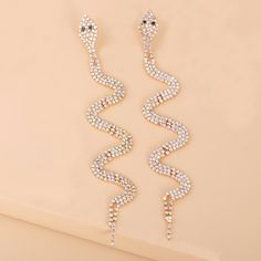 Channel your serpentine side with these lovely 18k gold-plated drop earrings outfitted with cubic zirconia. 0.98" W x 5.51" L 18k gold-plated copper / cubic zirconia Drop Earrings Outfit, Long Snake, Earrings Outfit, Snake Earrings, Sparkling Diamond, Party Earrings, Gold Snake, Stunning Earrings, Accessories Jewelry Earrings