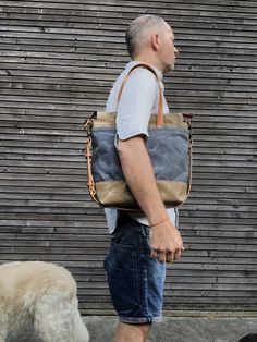 Tote bag in American heavy weight waxed canvas. The color is sage for the body, the magazine pocket that runs over the bottom for extra durability is made in heavy weight waxed canvas in also in sage, with a double outside pocket on the other side in medium weight black waxed canvas in grey. I made it into an everyday bag perfect for the office, with leather handles, shoulder strap, and 3 outside pockets Closing with a zipper on top. Including a leather shoulder strap, adjustable and detachable. Khaki Waxed Finish Shoulder Bag For Everyday Use, Urban Waxed Canvas Bag For Everyday Use, Khaki Canvas Shoulder Bag With Waxed Finish, Everyday Carry Waxed Canvas Bag With Leather Handles, Waxed Canvas Bag For Everyday Carry, Khaki Waxed Canvas Bag For Daily Use, Everyday Carry Canvas Bag With Waxed Finish, Everyday Carry Waxed Canvas Bag, Khaki Waxed Canvas Bag With Waxed Finish