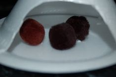 three pieces of food sitting on top of a white plate