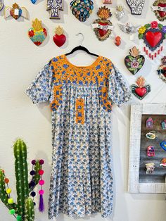 Our San Antonino dresses are unique, beautiful and perfect for any fiesta, a day at the beach or a formal event. You can easily dress it up or dress it down. Our dresses are completely hand embroidered by Artisans in Oaxaca, Mexico. It takes approximately 1 month to complete one dress.  Our San Antonino dresses are one of a kind. You will fall in love with every single detail. Each dress is hand embroidered on front chest area, sides and back with tiny floral designs inspired by the flowers in the region using beautiful color combinations. Crochet on sleeve and neckline. Across the chest, it has the "Hazme Si Puedes" (Make Me if You Can) technique, distinctive to their community. This intricate crochet technique shows tiny men and women lined together holding hands.  -Fabric & thread are 1 Festival Floral Print Short Sleeve Dresses, Maxi Length Dress With Multicolor Intricate Embroidery, Maxi Dress With Intricate Multicolor Embroidery, Multicolor Midi Dress With Floral Embroidery, Multicolor Embroidered Floral Dress, Floral Embroidered Short Sleeve Sundress, Multicolor Embroidered Floral Midi Dress, Multicolor Maxi Dress With Floral Embroidery, Multicolor Embroidered Floral Print Short Sleeve Dress