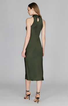 A classic bias cut dress with an elegantly draped high cowl neck. This sleeveless dress is cut in a flattering tea length with a clean baby hem finish. This dress is unlined and needs only a back neckline keyhole closure thanks to the nature of bias cut fabric. Sleeveless Silk Dress With Back Opening For Formal Occasions, Silk Midi Slip Dress With Side Slits, Sleeveless Silk Slip Dress With Side Slits, Sleeveless Sleek Maxi Dress With Flattering Silhouette, Classic Silk Sleeveless Maxi Dress, Sleek Sleeveless Maxi Dress With Flattering Silhouette, Silk Midi Dress With Back Opening For Date Night, Classic Evening Sleeveless Silk Dress, Classic Sleeveless Silk Evening Dress