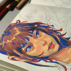 a drawing of a young man with blue hair and red eyes is shown in front of colored pencils