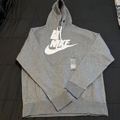 Brand New Never Worn Casual Athletic Heather Hoodie With Drawstring, Casual Hoodie With Adjustable Hood In Athletic Heather, Casual Athletic Heather Hoodie With Adjustable Hood, Casual Athletic Heather Sweatshirt With Adjustable Hood, Nike Hoodie With Logo Print For Fall, Casual Nike Cotton Hoodie, Casual Hoodie With Adjustable Hood In Heather Gray, Nike Casual Cotton Hoodie, Casual Nike Hoodie Sweatshirt