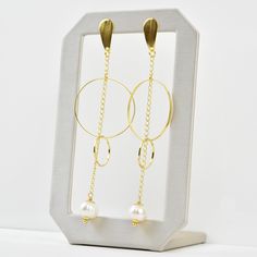 Earrings measure about 3.75" long Post style earring Fresh water pearls Gold over brass Imported from Brazil More from Creative Brazil About Creative Brazil Collection Jewelry handmade in Brazil that combines tropical and mid-century design sensibilities. Goldmakers Jewelry Mission Statement Goldmakers Jewelry creates and curates a comprehensive selection of artfully designed hand-crafted jewelry. We aspire to offer the jewelry enthusiast access to affordable classics as well as fresh innovative Modern Gold Long Drop Pearl Earrings, Pearl Chain Round Metal Earrings, Modern Pearl Chain Earrings, Modern Gold Linear Earrings With Pearl Drop, Modern Gold Metal Pearl Earrings, Modern Pearl Chain Earrings As Gift, Modern Gold Earrings With Pearl Chain, Modern Pearl Chain Dangle Earrings, Modern Dangle Pearl Chain Earrings