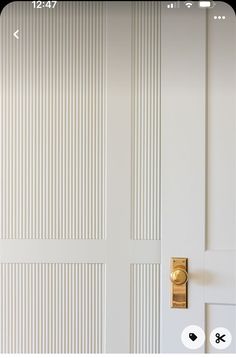 a white door with a gold handle on it