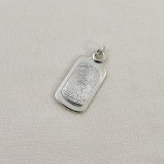 Fingerprint Dog Tag Pendant Layered Elements Sterling Silver Etched Dog Tag Jewelry, Etched Sterling Silver Dog Tag Jewelry, Sterling Silver Rectangular Pendant Keepsake Jewelry, Sterling Silver Dog Tag Jewelry With Engraving Option, Silver Stamped Oval Pendant Jewelry, Sterling Silver Oval Pendant Necklace With Engraving Option, Silver Oval Pendant Jewelry With Engraving Option, Silver Jewelry With Engraving Option, Oval Pendant, Classic Sterling Silver Oblong Jewelry