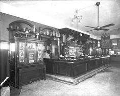 an old black and white photo of a bar