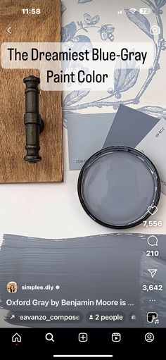 the blue gray paint color is next to a magnifying glass and some other items