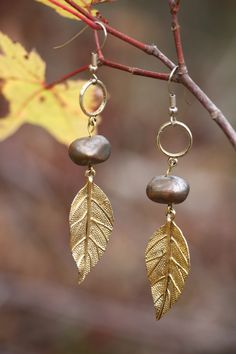 "Pair of beautiful, vintage, brass and stainless steel, leaf dangle earrings.  Keep the love, wear, and story going with Vintage Sustainable Jewelry from shopBIOME. Proceeds support my permaculture homestead in Maine: growing food and perennial plant diversity. This shop is also partnered with Eden Reforestion Projects to plant 5 TREES with each order!  Check out how many we've planted so far!  http://donors.edenprojects.org/user/biome/ \"Together Building a Regenerative Future\" * www.bi-ome.co Nickel-free Leaf-shaped Brass Jewelry, Bohemian Brass Leaf Jewelry, Bohemian Leaf-shaped Brass Jewelry, Gold Nature-inspired Metal Earrings, Rustic Brass Dangle Earrings, Rustic Brass Drop Earrings, Nature-inspired Nickel-free Gold Earrings, Nature-inspired Gold Nickel-free Earrings, Leaf-shaped Brass Earrings For Gift