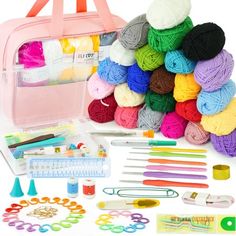 an assortment of crafting supplies including yarn, crochet hooks and scissors