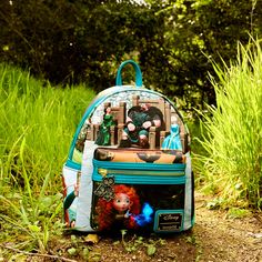 Take fate into your own hands. The Loungefly Brave Merida Princess Scene Mini Backpack features unique scenes from Disney-Pixar’s animated feature displayed across each panel of the bag. Turn the backpack around and you will find inspiring moments from Merida’s journey, including her meeting with a will-o’-the-whisp and transformative events with her family. An enamel zipper charm of Merida’s brothers in bear form completes the scene. This spellbound accessory will keep your belongings safe on a Disney Character Print Standard Backpack, Themed Travel Backpack, Themed Green Standard Backpack, Disney Themed Standard Backpack For Theme Park, Themed Travel Backpack Bags, Themed Backpack With Case Included, Disney Backpack With Case For School, Disney Backpack For School With Case Included, Themed Backpack For Theme Park