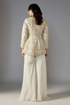 Ivory peplum jacket with sequin bead embellished floral swirl patterns. Comes with solid sharara. - Aza Fashions Traditional Off White Long Sleeve Palazzo Set, Long Sleeve Sets With Gota Work For Reception, White Palazzo Set With Intricate Embroidery And Long Sleeves, White Long Sleeve Palazzo Set With Intricate Embroidery, Traditional Cream Long Sleeve Palazzo Set, Traditional Cream Palazzo Set With Long Sleeves, Traditional Long Sleeve Cream Palazzo Set, Cream Anarkali Palazzo Set With Long Sleeves, Wedding Nehru Jacket With Gota Work And Long Sleeves