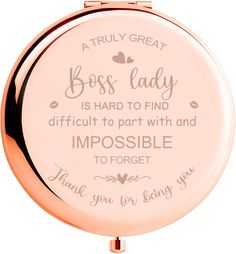 a rose gold compact mirror with the words boss lady on it's front side