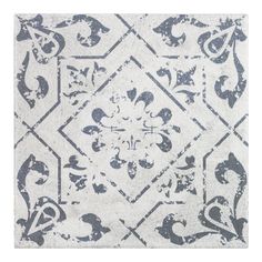 a white and blue rug with an ornate design