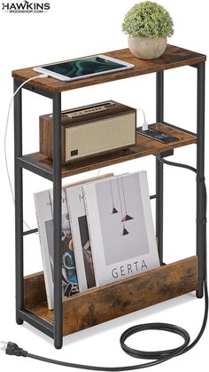 a wooden shelf with books and magazines on it, next to a power cord that is plugged into an outlet