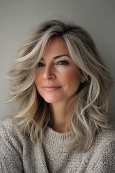 33 Amazing Shoulder-Length Hairstyles for Women Over 50 in 2024 – CreativeBooster Feathered Layers, Soft Face, Warm Blonde