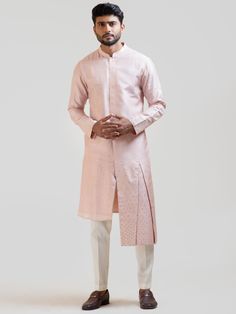 This Onion Pink Embroidered kurta set will instantly give an elegant look. This 2 piece kurta set features an onion pink bam silk kurta with box pleat detail on high and low panels, butti embroidery, front buttons fastening, and a mandarin collar. It is paired with narrow fitted pajama pants in cream color and malai cotton fabric. An ideal outfit for traditional occasions, and special events.

Size Chart For Men





	
	
					Men's Size Chart
		

		
		
						
				Size Chart For Men
				Custom Si Transitional Silk Pink Kurta, Transitional Pink Silk Kurta, Silk Kurta For Formal Occasions, Transitional Season Pink Straight Kurta, Formal Pink Kurta With Dabka Details, Pink Kurta For Formal Transitional Events, Formal Cotton Silk Sherwani For Eid, Formal Silk Bandhgala With Straight Kurta, Pink Formal Kurta For Transitional Season